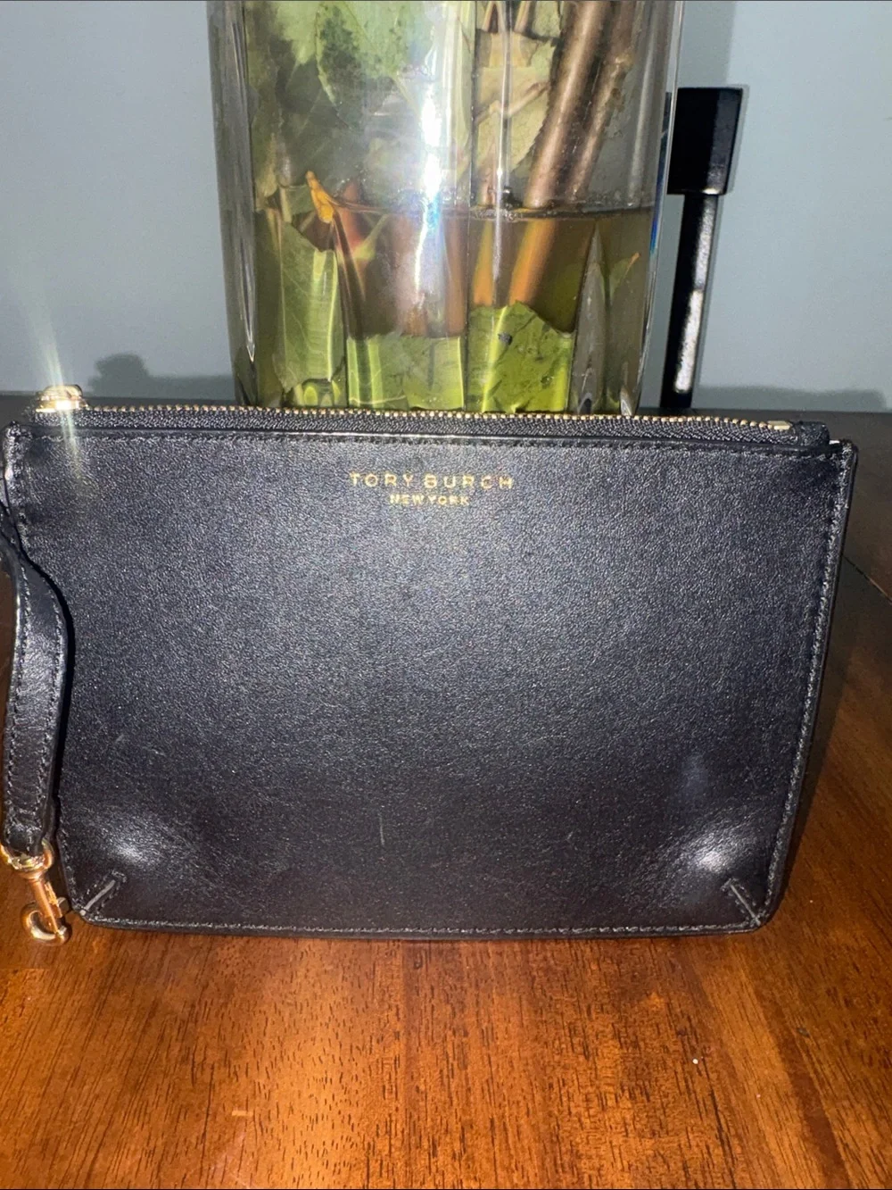Tory Burch Black Leather Wristlet with Gold Logo. Like new no callouts